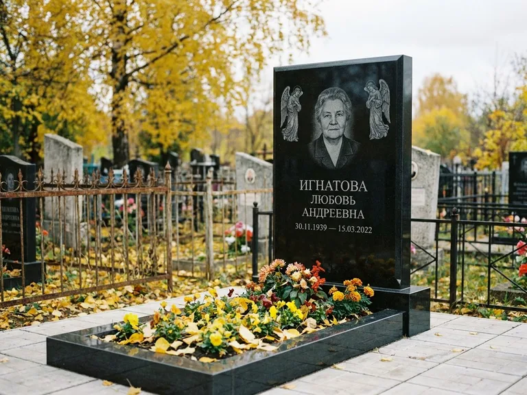 Памятник с гравировкой ангела — гравировка двух ангелов по сторонам портрета, работа «Игнатова» в Перми